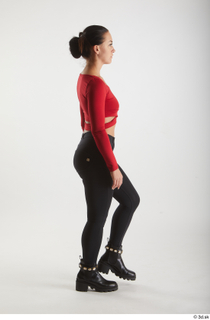  Zuzu Sweet  1 black boots black trousers casual dressed red long sleeve t shirt side view walking whole body 0003.jpg